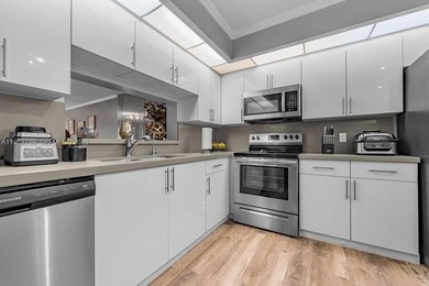 Beautifully renovated 2-bedroom, 2-bathroom apartment located in on Flamingo Lakes Country Club in Florida - for sale on GolfHomes.com, golf home, golf lot