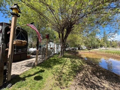ENJOY AND RELAX!  Shade trees, pavers, flower garden, sprinkler on Cascade Golf Course in Idaho - for sale on GolfHomes.com, golf home, golf lot