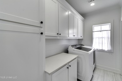 This welcoming Lake Caroline Home in Madison, MS offers high on Lake Caroline Golf Club in Mississippi - for sale on GolfHomes.com, golf home, golf lot