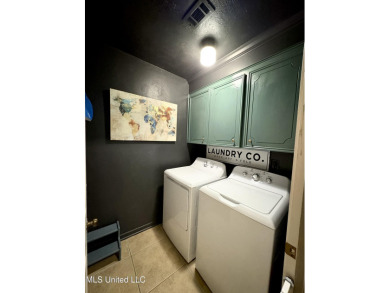Beautifully updated 4 bedroom home is walking distance to the on Castlewoods Golf Club in Mississippi - for sale on GolfHomes.com, golf home, golf lot