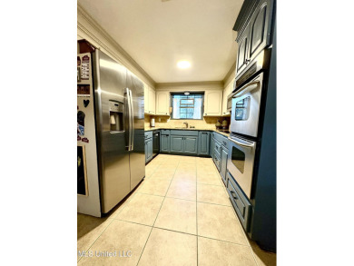 Beautifully updated 4 bedroom home is walking distance to the on Castlewoods Golf Club in Mississippi - for sale on GolfHomes.com, golf home, golf lot