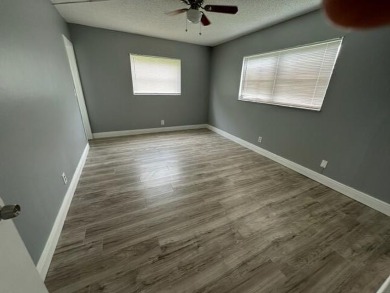 55+ COMMUNITY.UNFURNISHED, BEST LOCATION, FIRST FLOOR CORNER on Marina Lakes Golf Course in Florida - for sale on GolfHomes.com, golf home, golf lot
