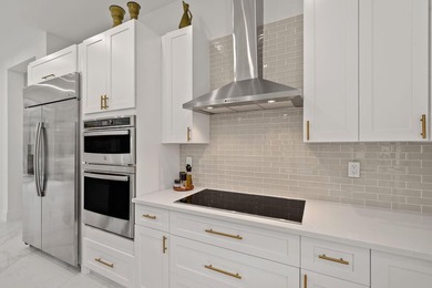 Step into your own private resort compound in Palm Beach Country on Jupiter Country Club in Florida - for sale on GolfHomes.com, golf home, golf lot