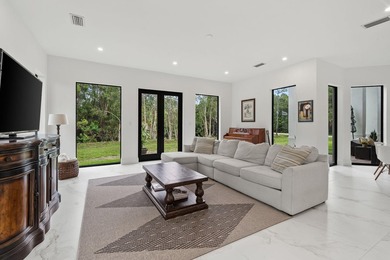 Step into your own private resort compound in Palm Beach Country on Jupiter Country Club in Florida - for sale on GolfHomes.com, golf home, golf lot