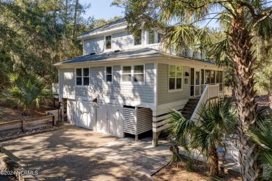 COASTAL HAVEN! Nestled in a grove of breathtaking palm trees in on Bald Head Island Golf Club in North Carolina - for sale on GolfHomes.com, golf home, golf lot