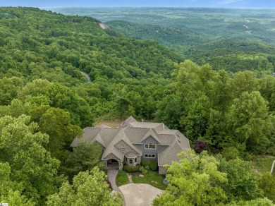 On a clear day this exceptional home, situated at an elevation on The Cliffs at Glassy Golf and Country Club in South Carolina - for sale on GolfHomes.com, golf home, golf lot