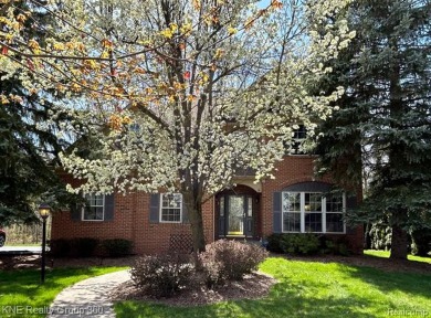 Explore this well-built 2,985 sq ft brick colonial in a on The Captains Club At Woodfield in Michigan - for sale on GolfHomes.com, golf home, golf lot