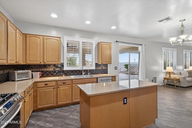 Spacious home in Johnson Ranch featuring 6 big bedrooms and 3 on The Golf Club At Johnson Ranch in Arizona - for sale on GolfHomes.com, golf home, golf lot