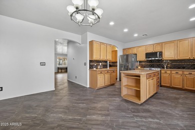 Spacious home in Johnson Ranch featuring 6 big bedrooms and 3 on The Golf Club At Johnson Ranch in Arizona - for sale on GolfHomes.com, golf home, golf lot