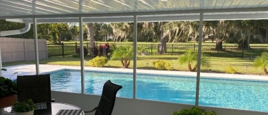 Pool home with golf course views and close to everything! New on Palm Harbor Golf Club in Florida - for sale on GolfHomes.com, golf home, golf lot