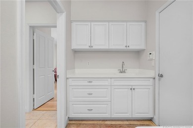 Exuding timeless sophistication and modern comfort, this elegant on Willoughby Golf Club in Florida - for sale on GolfHomes.com, golf home, golf lot