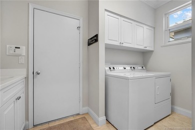 Exuding timeless sophistication and modern comfort, this elegant on Willoughby Golf Club in Florida - for sale on GolfHomes.com, golf home, golf lot