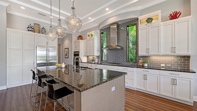 Set in Lakewood Ranch's Country Club East, this exceptional on Ritz-Carlton Members Golf Club in Florida - for sale on GolfHomes.com, golf home, golf lot