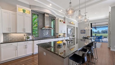 Set in Lakewood Ranch's Country Club East, this exceptional on Ritz-Carlton Members Golf Club in Florida - for sale on GolfHomes.com, golf home, golf lot