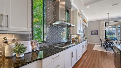 Set in Lakewood Ranch's Country Club East, this exceptional on Ritz-Carlton Members Golf Club in Florida - for sale on GolfHomes.com, golf home, golf lot