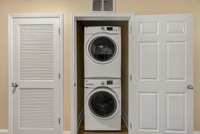 Step inside this beautifully maintained Laketown Wharf condo on Signal Hill Golf Course, Inc. in Florida - for sale on GolfHomes.com, golf home, golf lot