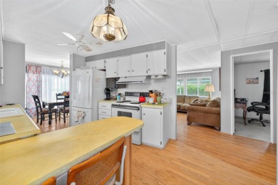 Charming 2-Bedroom Home with Co-op Share in Active 55+ on Lakes at Leesburg Golf Course in Florida - for sale on GolfHomes.com, golf home, golf lot