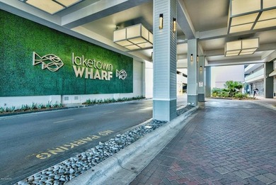 Step inside this beautifully maintained Laketown Wharf condo on Signal Hill Golf Course, Inc. in Florida - for sale on GolfHomes.com, golf home, golf lot
