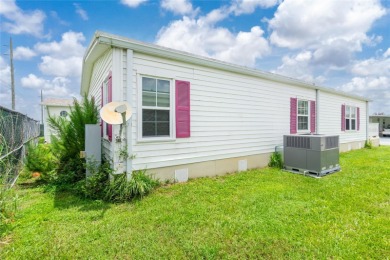 This cute and charming 2 bedroom, 2 bath manufactured home is on Maple Leaf Golf and Country Club in Florida - for sale on GolfHomes.com, golf home, golf lot