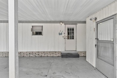 Charming 2-Bedroom Home with Co-op Share in Active 55+ on Lakes at Leesburg Golf Course in Florida - for sale on GolfHomes.com, golf home, golf lot
