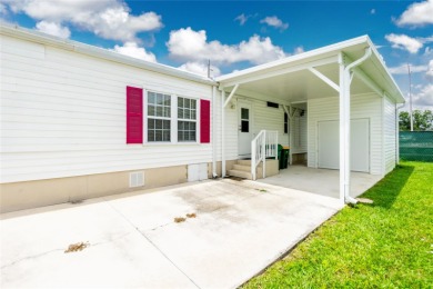 This cute and charming 2 bedroom, 2 bath manufactured home is on Maple Leaf Golf and Country Club in Florida - for sale on GolfHomes.com, golf home, golf lot