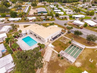 Charming 2-Bedroom Home with Co-op Share in Active 55+ on Lakes at Leesburg Golf Course in Florida - for sale on GolfHomes.com, golf home, golf lot