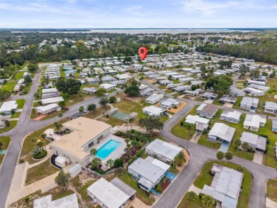Charming 2-Bedroom Home with Co-op Share in Active 55+ on Lakes at Leesburg Golf Course in Florida - for sale on GolfHomes.com, golf home, golf lot