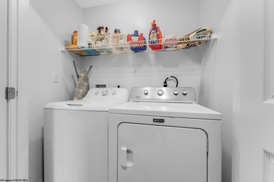 Discover your perfect retreat in this move-in-ready townhome on Meadow Ponds Golf and Country Club in West Virginia - for sale on GolfHomes.com, golf home, golf lot