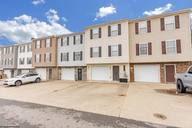 Discover your perfect retreat in this move-in-ready townhome on Meadow Ponds Golf and Country Club in West Virginia - for sale on GolfHomes.com, golf home, golf lot