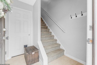 Discover your perfect retreat in this move-in-ready townhome on Meadow Ponds Golf and Country Club in West Virginia - for sale on GolfHomes.com, golf home, golf lot