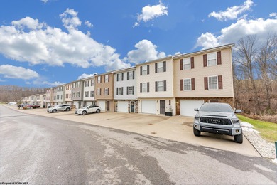 Discover your perfect retreat in this move-in-ready townhome on Meadow Ponds Golf and Country Club in West Virginia - for sale on GolfHomes.com, golf home, golf lot
