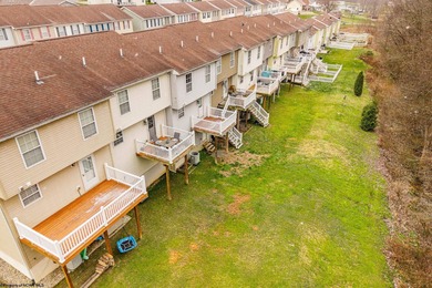 Discover your perfect retreat in this move-in-ready townhome on Meadow Ponds Golf and Country Club in West Virginia - for sale on GolfHomes.com, golf home, golf lot