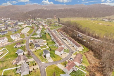 Discover your perfect retreat in this move-in-ready townhome on Meadow Ponds Golf and Country Club in West Virginia - for sale on GolfHomes.com, golf home, golf lot