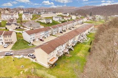 Discover your perfect retreat in this move-in-ready townhome on Meadow Ponds Golf and Country Club in West Virginia - for sale on GolfHomes.com, golf home, golf lot