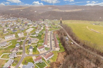 Discover your perfect retreat in this move-in-ready townhome on Meadow Ponds Golf and Country Club in West Virginia - for sale on GolfHomes.com, golf home, golf lot