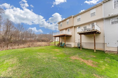 Discover your perfect retreat in this move-in-ready townhome on Meadow Ponds Golf and Country Club in West Virginia - for sale on GolfHomes.com, golf home, golf lot