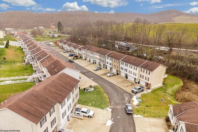 Discover your perfect retreat in this move-in-ready townhome on Meadow Ponds Golf and Country Club in West Virginia - for sale on GolfHomes.com, golf home, golf lot