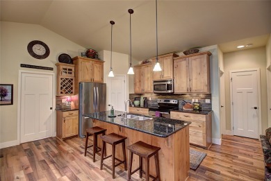 Warm tones & tasteful decor welcome you to this luxury 4bd/3ba on Meadow Lake Golf Resort in Montana - for sale on GolfHomes.com, golf home, golf lot