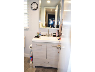 Nice, first floor 1 bedroom apartment with renovated kitchen on Sunrise Lakes Phase III in Florida - for sale on GolfHomes.com, golf home, golf lot