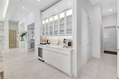 ELEVATED & LUXURIOUS This is a rare opportunity to own a on The Golf Club At Fiddlers Creek in Florida - for sale on GolfHomes.com, golf home, golf lot