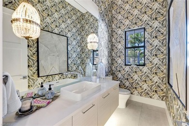 ELEVATED & LUXURIOUS This is a rare opportunity to own a on The Golf Club At Fiddlers Creek in Florida - for sale on GolfHomes.com, golf home, golf lot