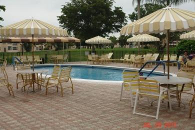 Nice, first floor 1 bedroom apartment with renovated kitchen on Sunrise Lakes Phase III in Florida - for sale on GolfHomes.com, golf home, golf lot