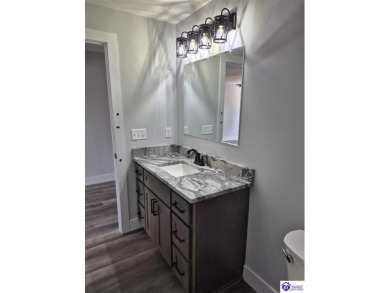 This one is a MUST SEE!  Contemporary Home with an Open Floor on Lincoln Trail Country Club in Kentucky - for sale on GolfHomes.com, golf home, golf lot