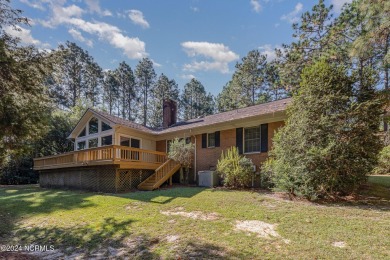 Welcome to this stunning brick home overlooking the 11th fairway on Whispering Pines Golf Course in North Carolina - for sale on GolfHomes.com, golf home, golf lot