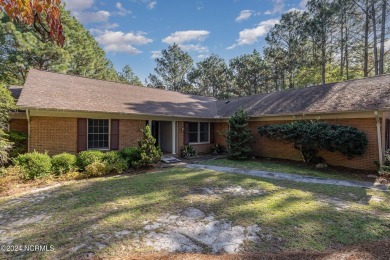 Welcome to this stunning brick home overlooking the 11th fairway on Whispering Pines Golf Course in North Carolina - for sale on GolfHomes.com, golf home, golf lot