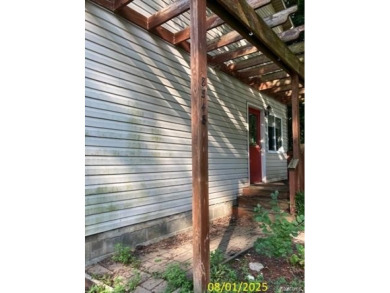 Make it your own in this two story home with 4 bedrooms and 2 on Rush Lake Hills Golf Club in Michigan - for sale on GolfHomes.com, golf home, golf lot