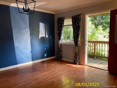 Make it your own in this two story home with 4 bedrooms and 2 on Rush Lake Hills Golf Club in Michigan - for sale on GolfHomes.com, golf home, golf lot