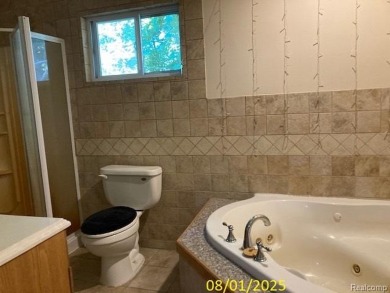 Make it your own in this two story home with 4 bedrooms and 2 on Rush Lake Hills Golf Club in Michigan - for sale on GolfHomes.com, golf home, golf lot