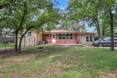 Welcome to your serene retreat in the gated community of on Hide-A-Way Lake Golf Course in Texas - for sale on GolfHomes.com, golf home, golf lot
