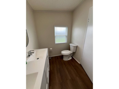 Move-In Ready in a highly sought after active yet peaceful 55+ on Lake Henry Golf Club in Florida - for sale on GolfHomes.com, golf home, golf lot
